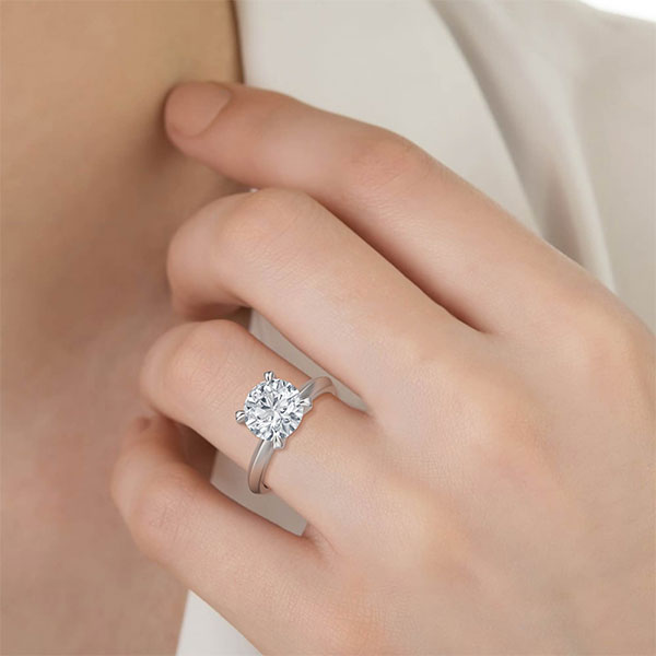 4 Open Claw Round Brilliant Cut Solitaire with a Solid Knife Edge Band